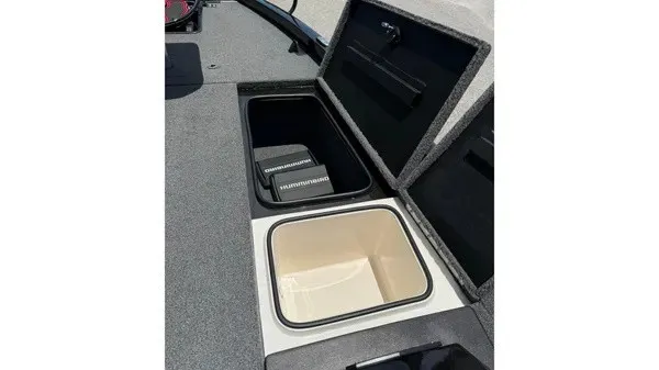 Slide: The Image of The image shows two open storage compartments on a boat, one containing a Humminbird device. - 12