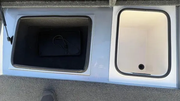Slide: The Image of The image shows two open storage compartments on a boat. One is dark, the other light. - 16