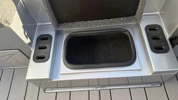 Slide: The Image of A gray boat compartment with a black insert on a 2024 Vexus AVX 1980. - 18