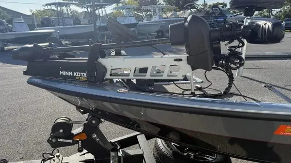 Slide: The Image of A 2024 Vexus AVX 1980 boat on a trailer. It features a Minn Kota trolling motor. - 7