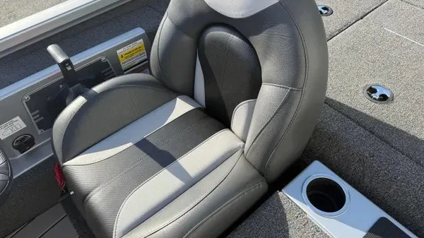 Slide: The Image of The 2024 Vexus AVX 1980 features a cushioned seat with gray and black upholstery and a cup holder. - 20