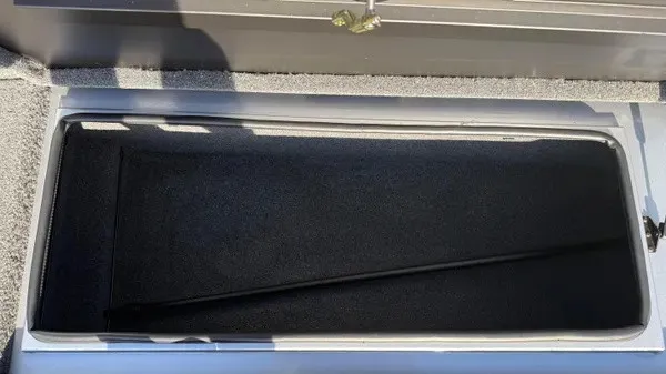 Slide: The Image of An open storage compartment on a 2024 Vexus AVX 1980 boat. - 15