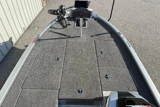 Slide: The Image of The image shows the deck of a 2024 Vexus AVX 1980 boat with gray carpeting. - 13
