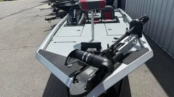 Slide: The Image of A 2018 Ranger RT188 boat with a trolling motor at the front, parked on a lot. - 6