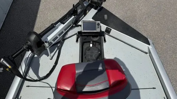 Slide: The Image of The image shows the cockpit of a 2018 Ranger RT188 boat with a red seat and a screen. - 9