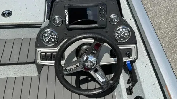Slide: The Image of The image shows the helm of a 2018 Ranger RT188 boat with a Lowrance fish finder. - 11