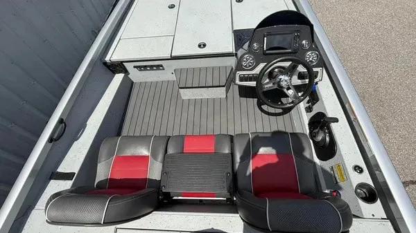 Slide: The Image of The image shows the cockpit of a 2018 Ranger RT188 boat with two seats and a helm. - 12