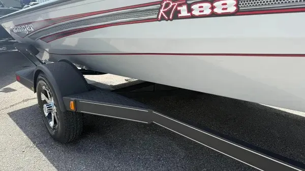 Slide: The Image of A gray 2018 Ranger RT188 boat on a trailer, featuring red accents and a black frame. - 2