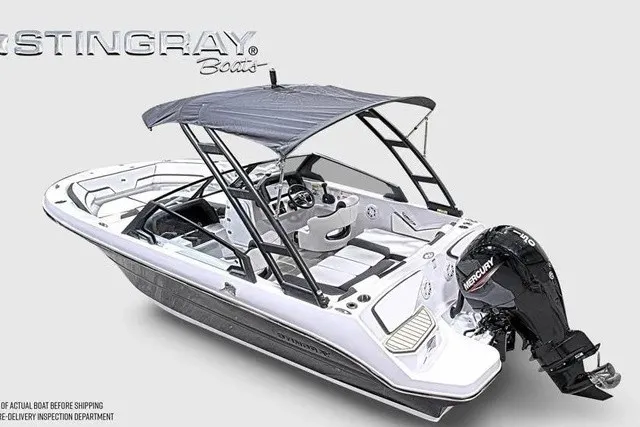 Slide: The Image of The image shows a modern Stingray 20 SBX boat with a gray canopy and an outboard motor. - 30