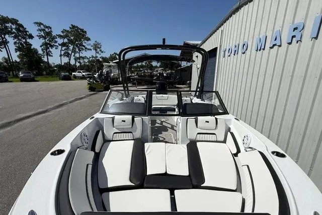 Slide: The Image of The image shows a modern Stingray 20 SBX boat with stylish white and black seating. - 27