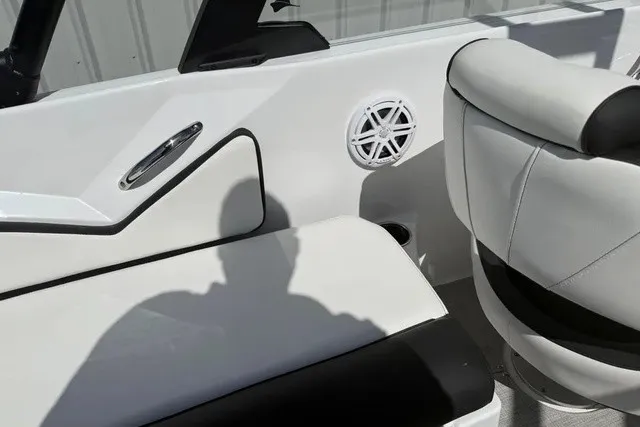 Slide: The Image of The interior of the 2027 Stingray 20 SBX features white upholstery and a speaker. - 20