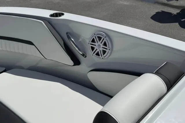 Slide: The Image of The image shows the sleek interior of a Stingray 20 SBX boat with modern speakers. - 14