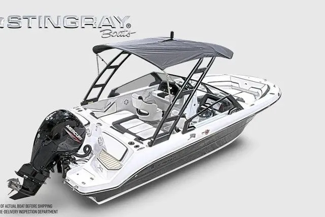 Slide: The Image of A modern 2027 Stingray 20 SBX with a black outboard motor and gray sunshade. - 33