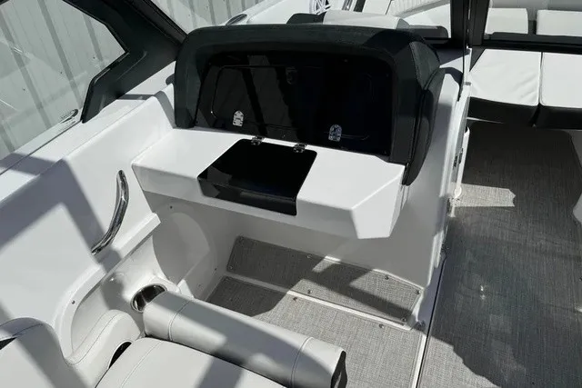 Slide: The Image of The image shows the cockpit of a 2027 Stingray 20 SBX boat with modern seating and controls. - 10