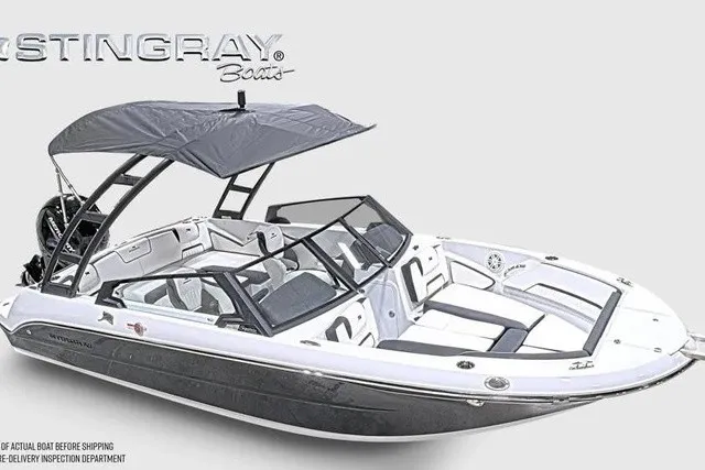 Slide: The Image of Stingray 20 SBX 2027: Sleek motorboat with modern design, black canopy, and comfortable seating. - 32