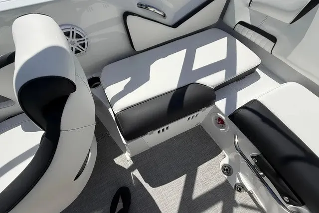 Slide: The Image of Interior of a modern boat with white and black seating and a speaker. - 18