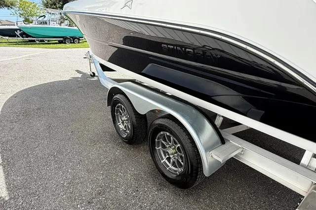 Slide: The Image of A 2027 Stingray 20 SBX boat on a trailer with dual wheels. - 5