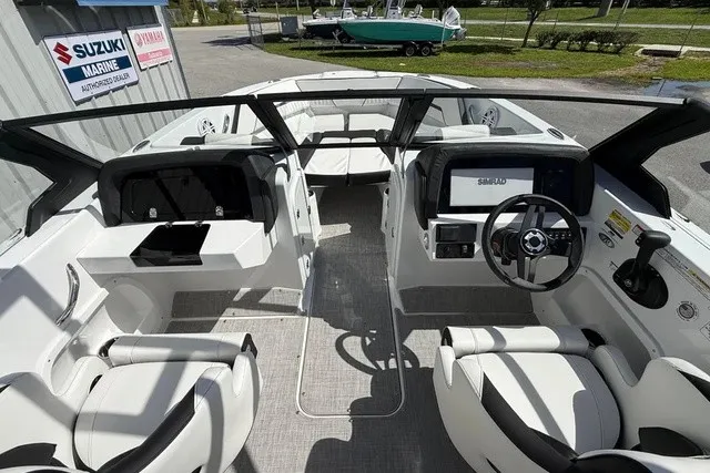 Slide: The Image of The image shows the cockpit of a modern Stingray 20 SBX boat with dual helm stations. - 8