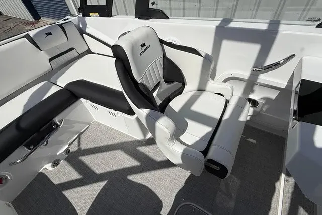 Slide: The Image of Interior of a modern boat with white and black seating. - 11