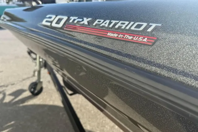 Slide: The Image of Close-up of the "20 TrX Patriot" lettering on a boat hull. - 2