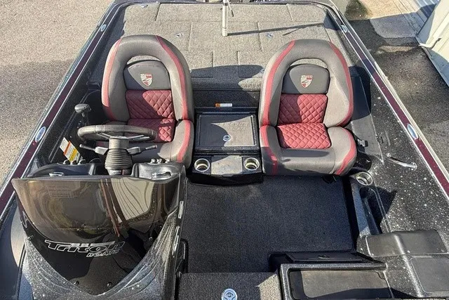 Slide: The Image of The image shows the cockpit of a 2019 Triton 20 TrX Patriot with two padded seats. - 9