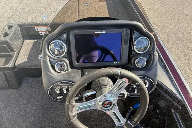 Slide: The Image of The image shows the cockpit of a 2019 Triton 20 TrX Patriot with a Lowrance fishfinder. - 11
