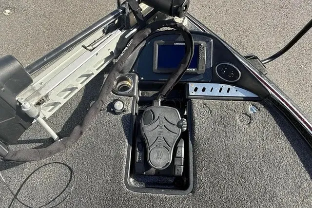 Slide: The Image of The image shows the cockpit of a 2019 Triton 20 TrX Patriot with a fish finder and controls. - 15