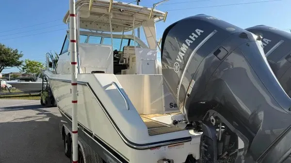 Slide: The Image of A 2007 Pursuit OS 335 Offshore with twin Yamaha outboard engines, parked on a trailer. - 4