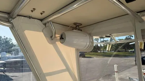 Slide: The Image of The cabin of a 2007 Pursuit OS 335 Offshore features a speaker system and clear windows. - 19