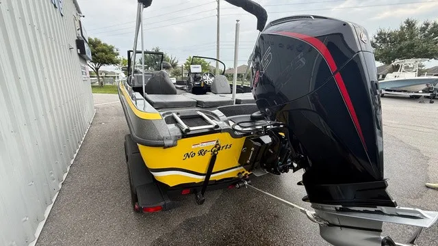 Slide: The Image of A yellow 2022 Nitro ZV19 boat with a large outboard motor. - 4