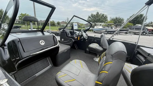 Slide: The Image of The image shows the cockpit of a 2022 Nitro ZV19 boat with gray seats and a helm station. - 5