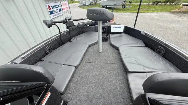 Slide: The Image of The image shows the cockpit of a 2022 Nitro ZV19 boat with gray upholstery. - 11