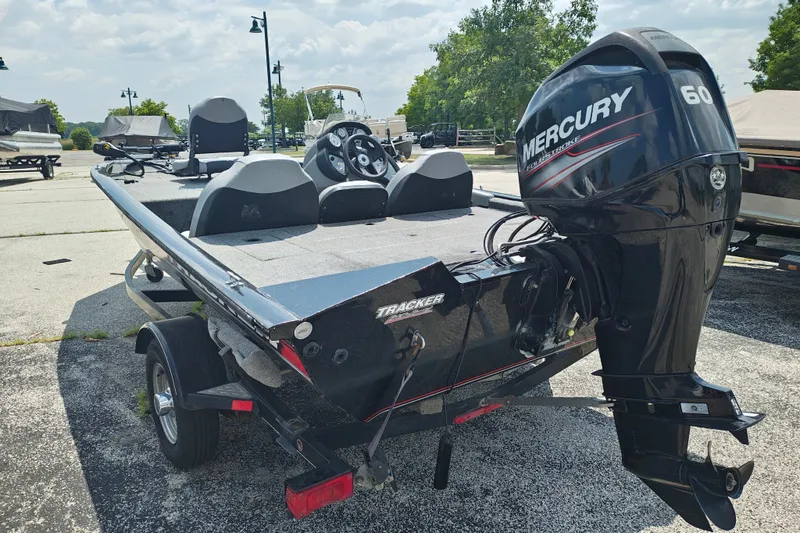 Slide: The Image of 2016 Tracker Pro Team 175 TXW boat with Mercury 60 engine, parked outdoors. - 4