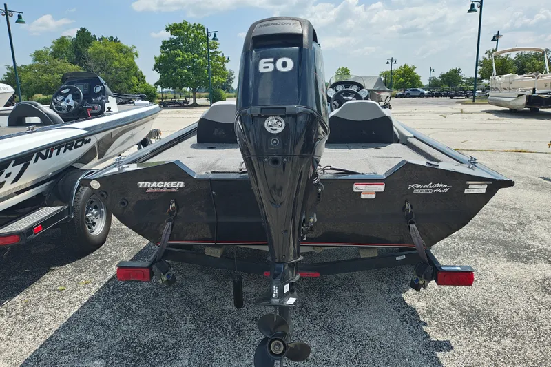 Slide: The Image of 2016 Tracker Pro Team 175 TXW boat with Mercury 60 engine in parking lot. - 3