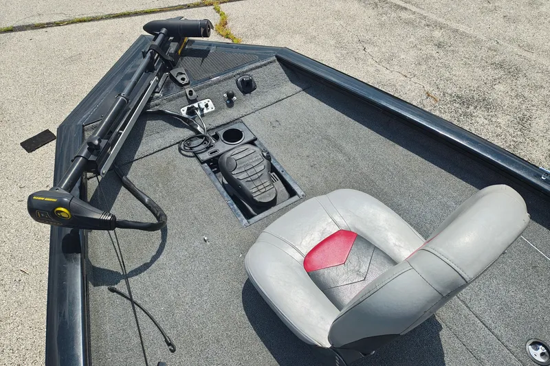 Slide: The Image of 2016 Tracker Pro Team 175 TXW boat interior with trolling motor and seat. - 9