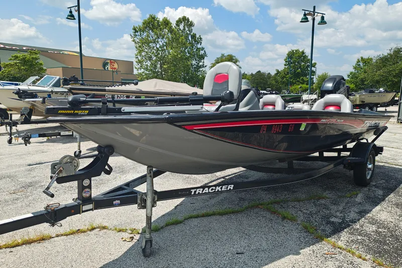 Slide: The Image of 2016 Tracker Pro Team 175 TXW fishing boat on trailer, parked outdoors. - 5