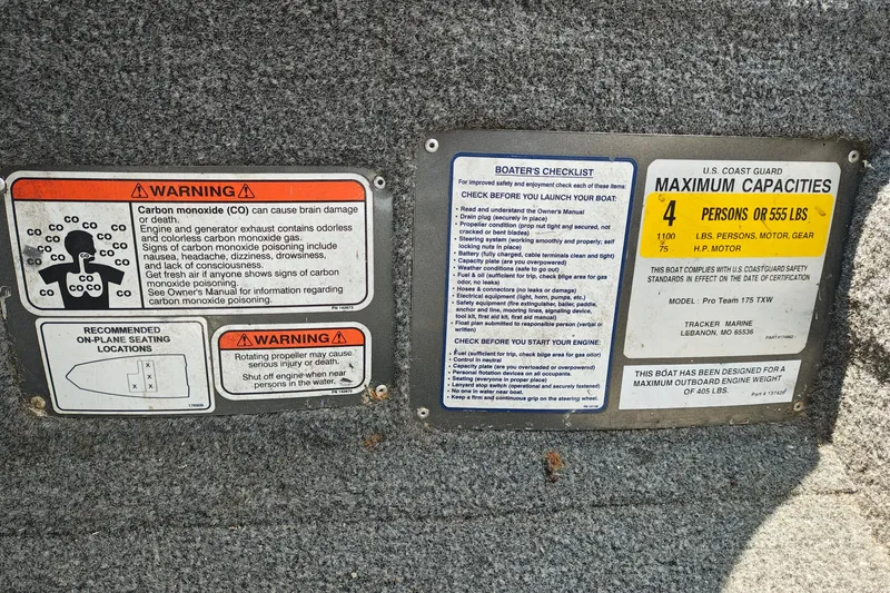 Slide: The Image of Warning and capacity labels on 2016 Tracker Pro Team 175 TXW boat interior. - 17