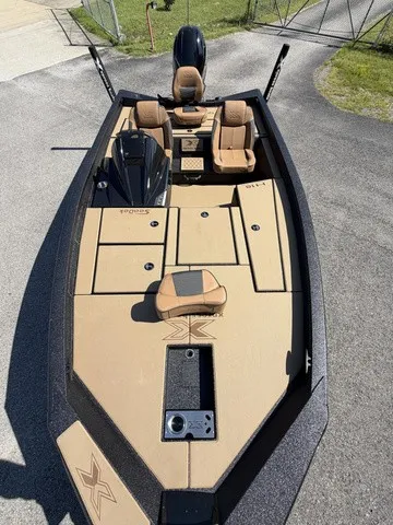 Slide: The Image of The image shows a 2026 Xpress Hyper-Lift Bass H18 boat with beige upholstery. - 6