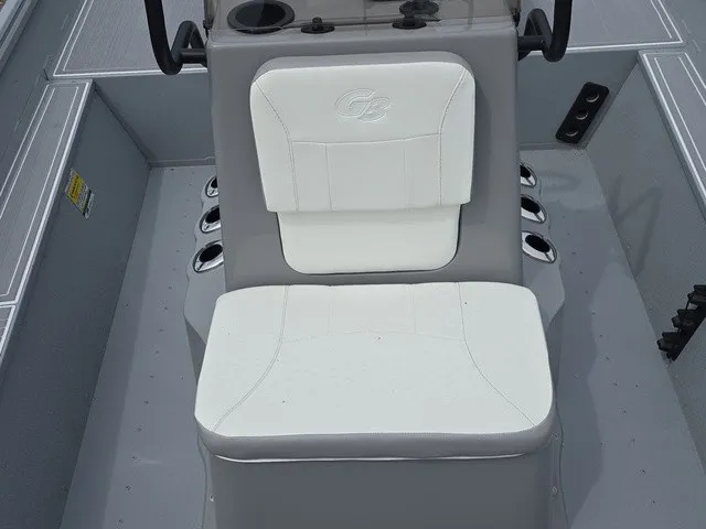 Slide: The Image of A gray and white seat in a G3 Bay 17 boat, surrounded by cup holders. - 22
