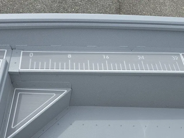 Slide: The Image of The image shows a gray boat with a built-in measuring scale on the side. - 23