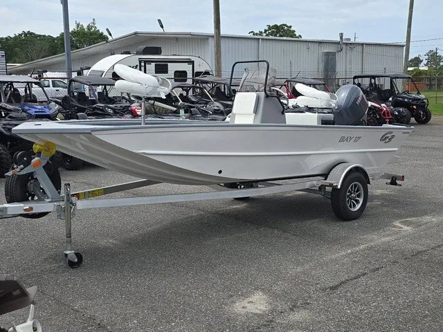Slide: The Image of A white 2026 G3 Bay 17 boat on a trailer in an outdoor setting. - 3