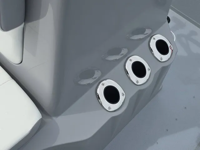 Slide: The Image of Close-up of three stainless steel cup holders on a gray boat. - 24