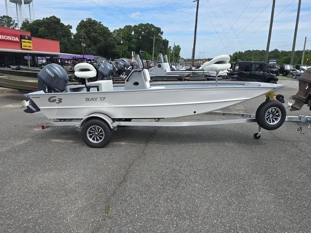 Slide: The Image of A 2026 G3 Bay 17 boat on a trailer, parked in a lot. - 7