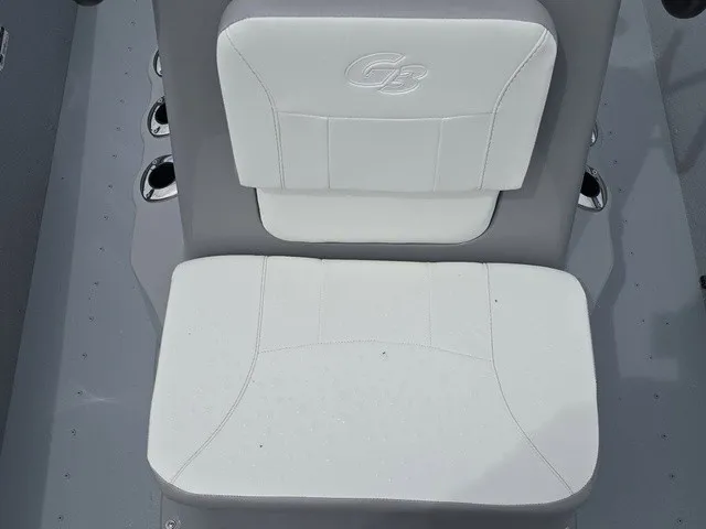 Slide: The Image of A white seat with G3 logo in a gray boat. - 25