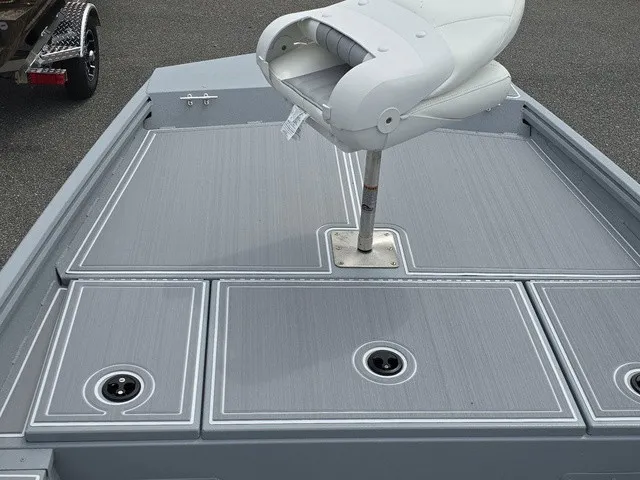 Slide: The Image of The image shows the deck of a G3 Bay 17 boat with gray flooring and a white seat. - 15