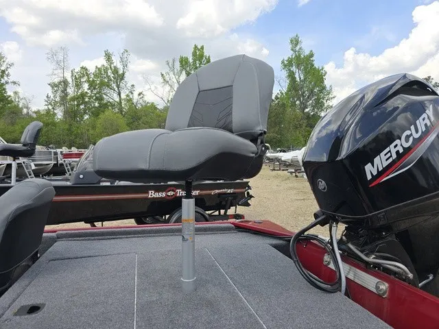 Slide: The Image of A 2025 Tracker Bass Tracker Classic XL with a gray seat and Mercury engine outdoors. - 15