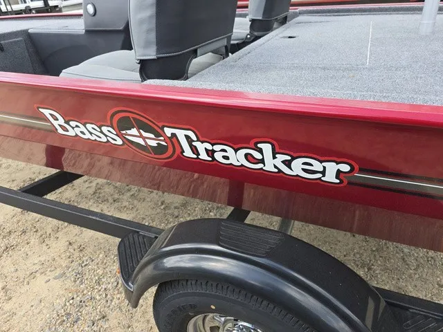 Slide: The Image of Close-up of a red 2025 Bass Tracker Classic XL boat on a trailer. - 12