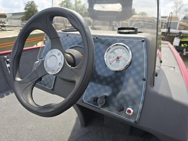 Slide: The Image of The image shows the helm of a 2025 Tracker Bass Tracker Classic XL with a tachometer. - 27