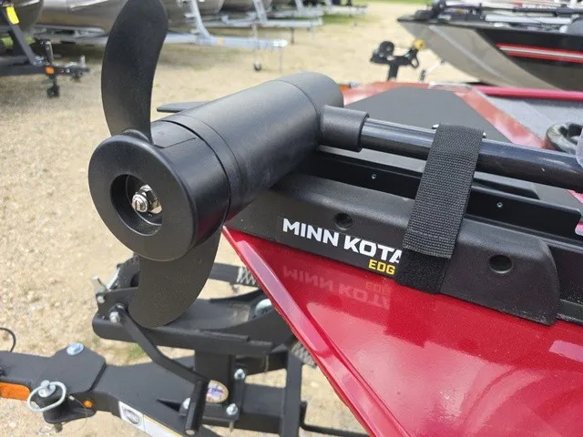 Slide: The Image of A red boat with a Minn Kota Edge trolling motor on a trailer. - 21