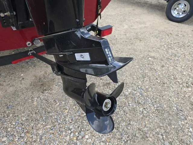 Slide: The Image of Close-up of an outboard motor with propeller on gravel ground. - 9